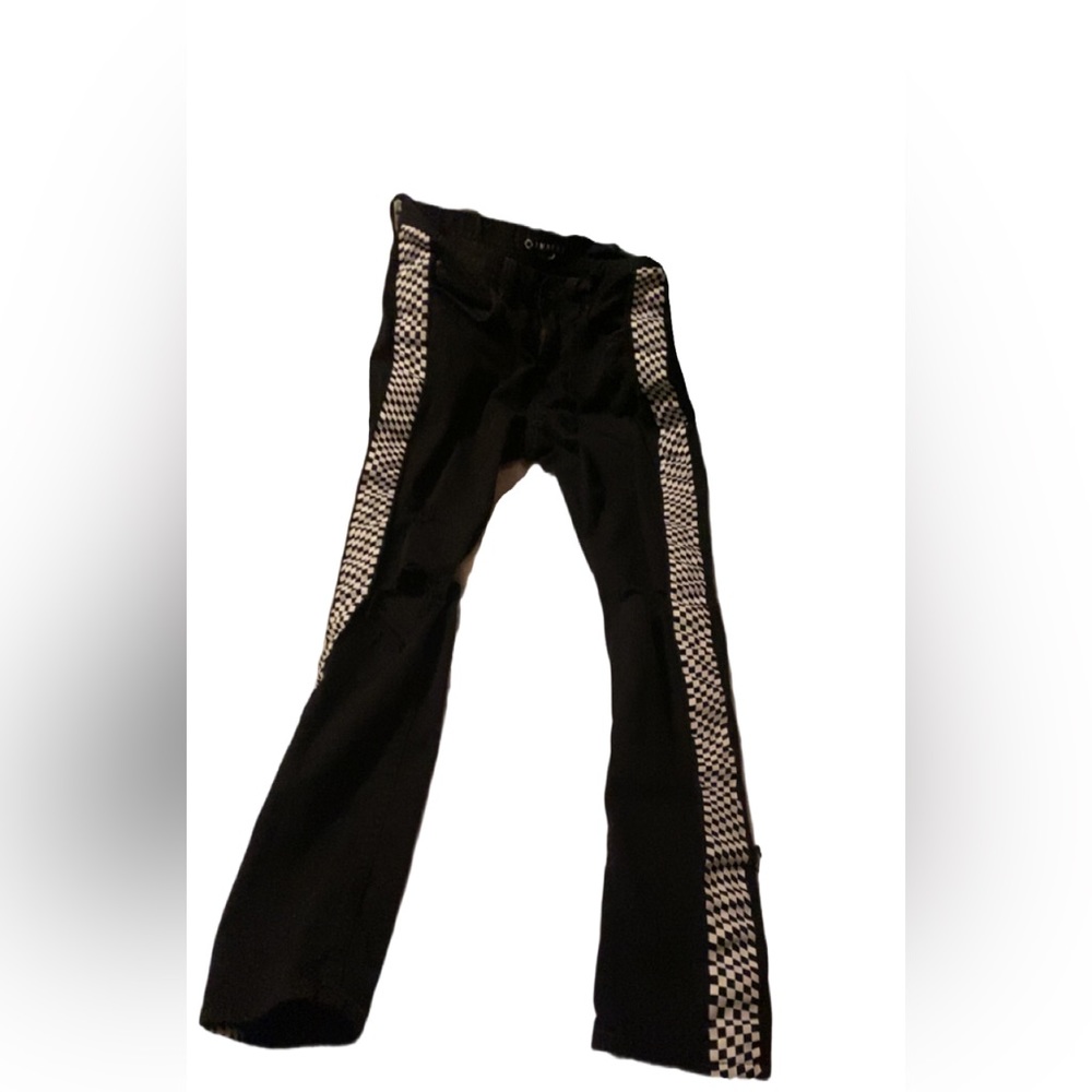 Black jeans with checkered stripes on the sides
